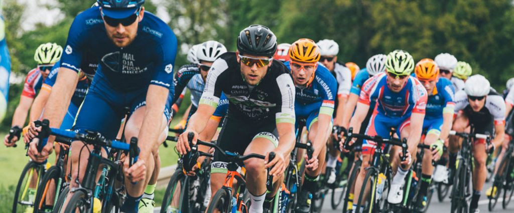 A group of cyclists engaged in a road race